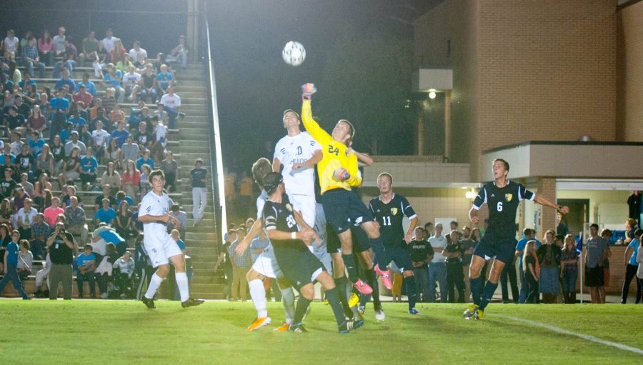 The Bruins’ Tommy Sims battles goalkeeper Stephen Replogle for the ball in Friday night’s win over Columbia. Photo: Emma Klak