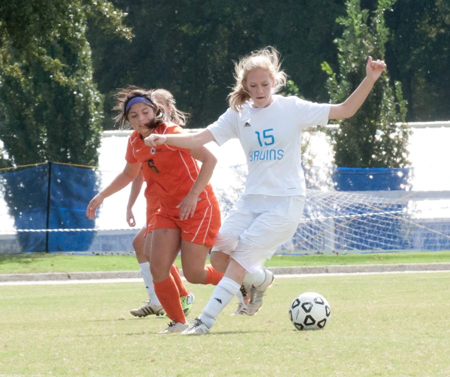 Bruin defender Abbe Mitchell steers the ball clear of the Suns’ offense during Monday’s victory. Photo: Stephanie Greenwood