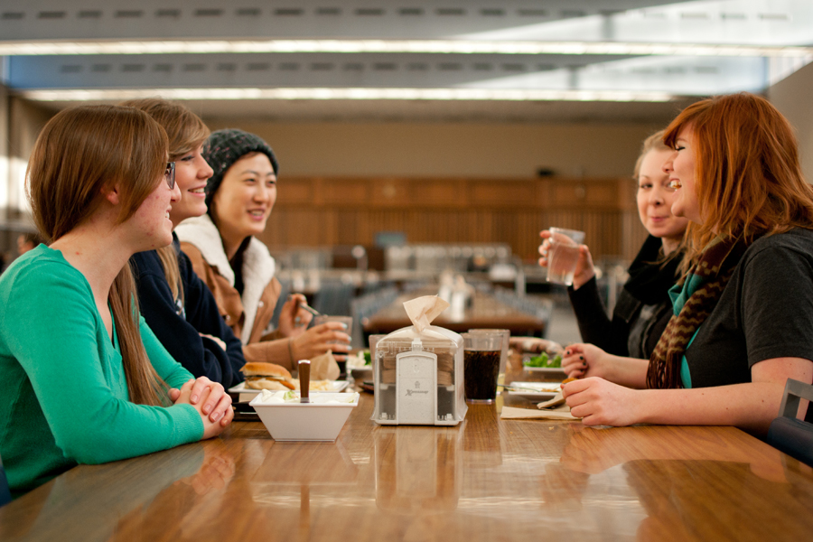 Students enjoy fellowship during a meal at the dining common. Photo: Emma Klak