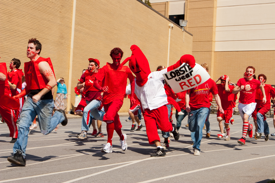 Decked out in team colors, members of the Red Lightning team run toward the athletic field during the 2009 Gold Rush Daze. Photo:  Photo Services