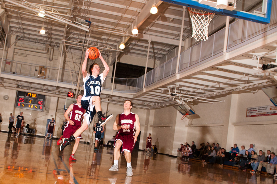 Chi Alpha sophomore guard Caleb Ketler soars toward the basket to make an impressive shot. Photo: Amy Roukes