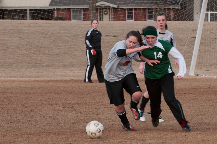 Tigers’ and Classics’ players battle for the ball during their matchup on Monday night. Photo: Cayla Smith