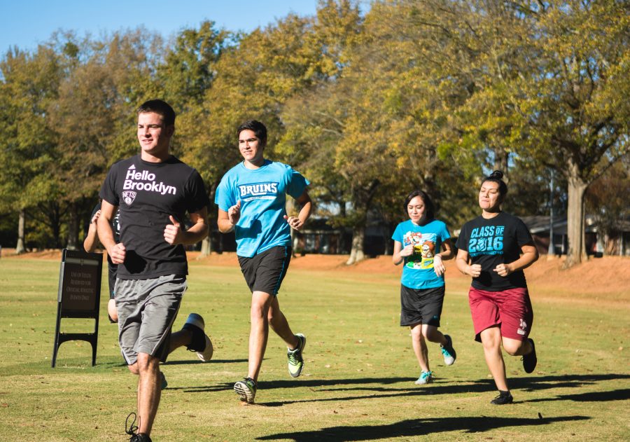 Josh Bickel, Brandon Valadez, Erica Rodriguez and Monica Rivera Cuevas train for the 5K with a run on back campus.  Photo: Dave Saunders 