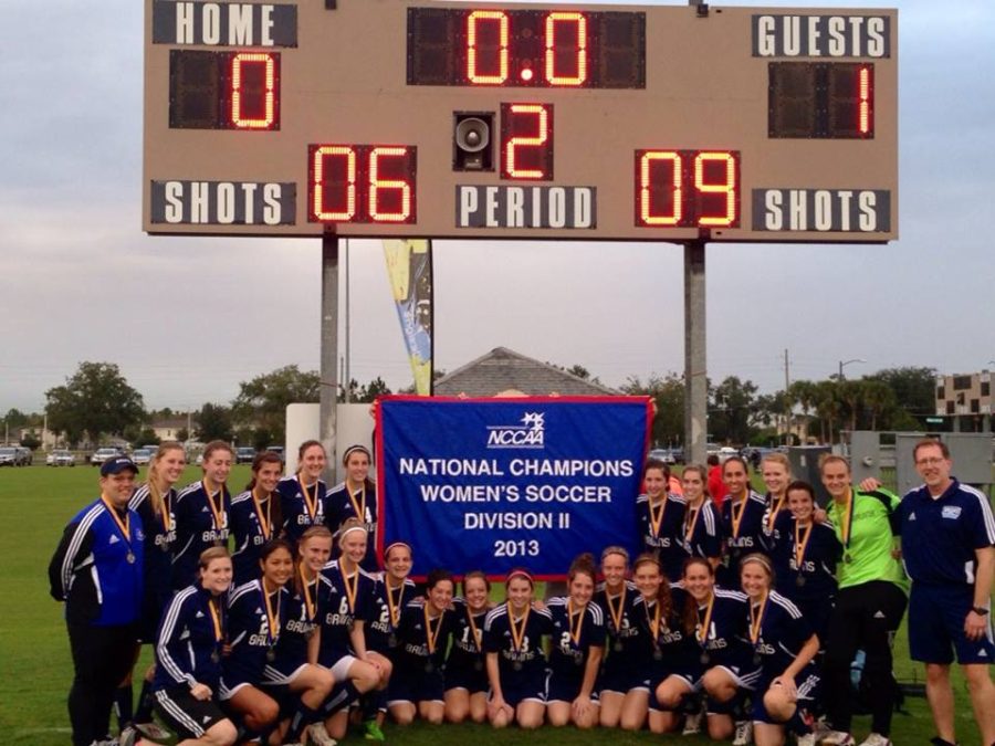 The women’s soccer team displays the championship banner.   Photo: Submitted 