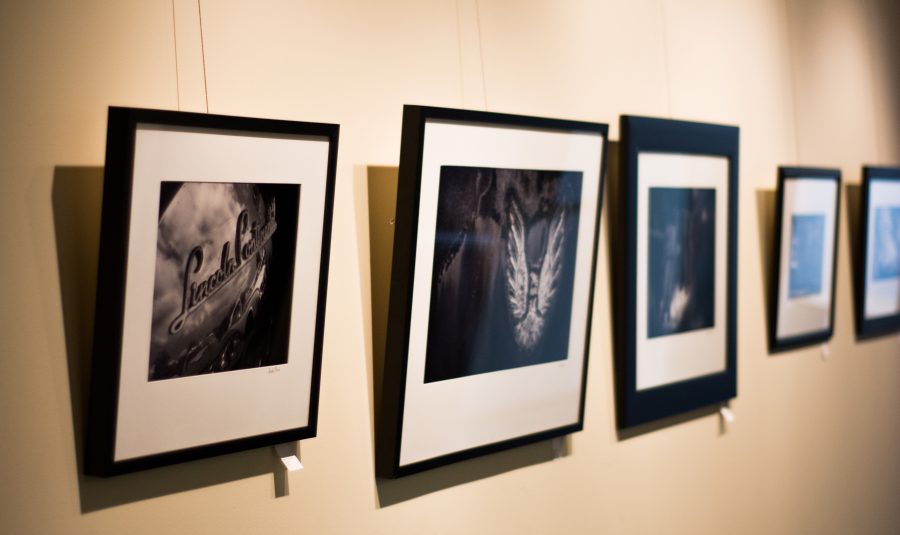 Student work hangs on the walls in an art exhibit at Greenville advertising agency, Jackson Marketing Group. Photo: Dave Saunders