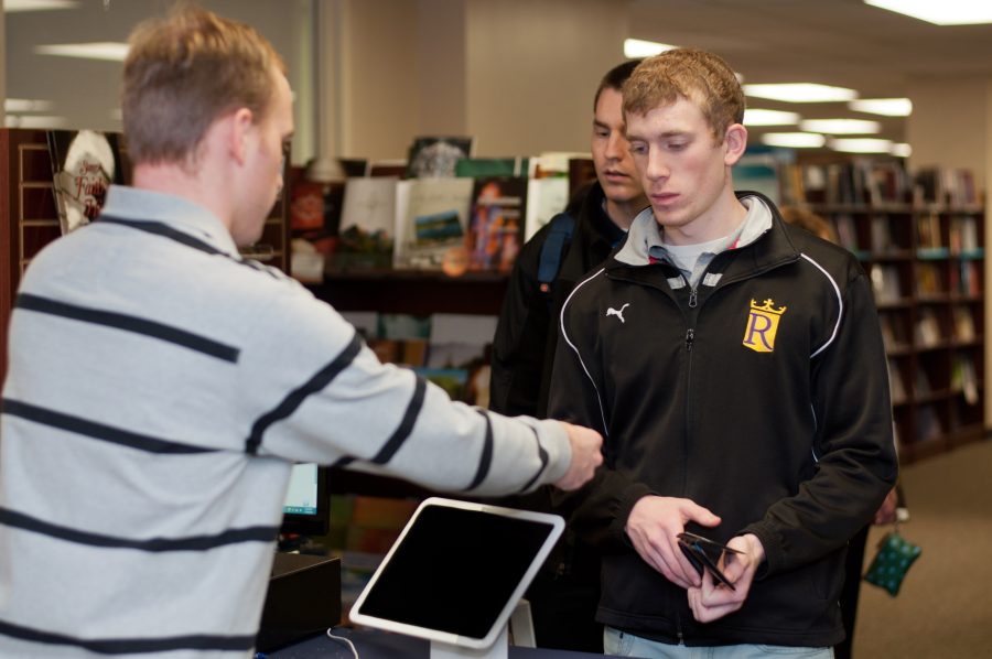 Students purchase course textbooks in the Campus Store, which recently outsourced textbook retail. Photo: Molly Waits