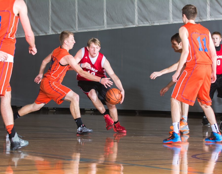 Phi Beta’s Tyler Collins attempts to stop Rams player Micah Gold as he dribbles down the court.    Photo: Dave Saunders
