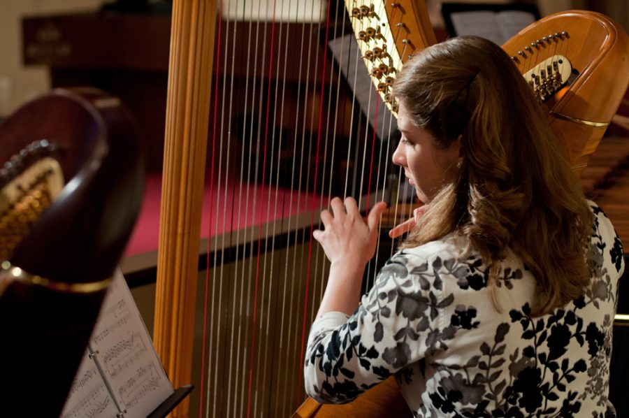 Musicians prepare for the upcoming harp and string concerts.  Photo:  Molly Waits