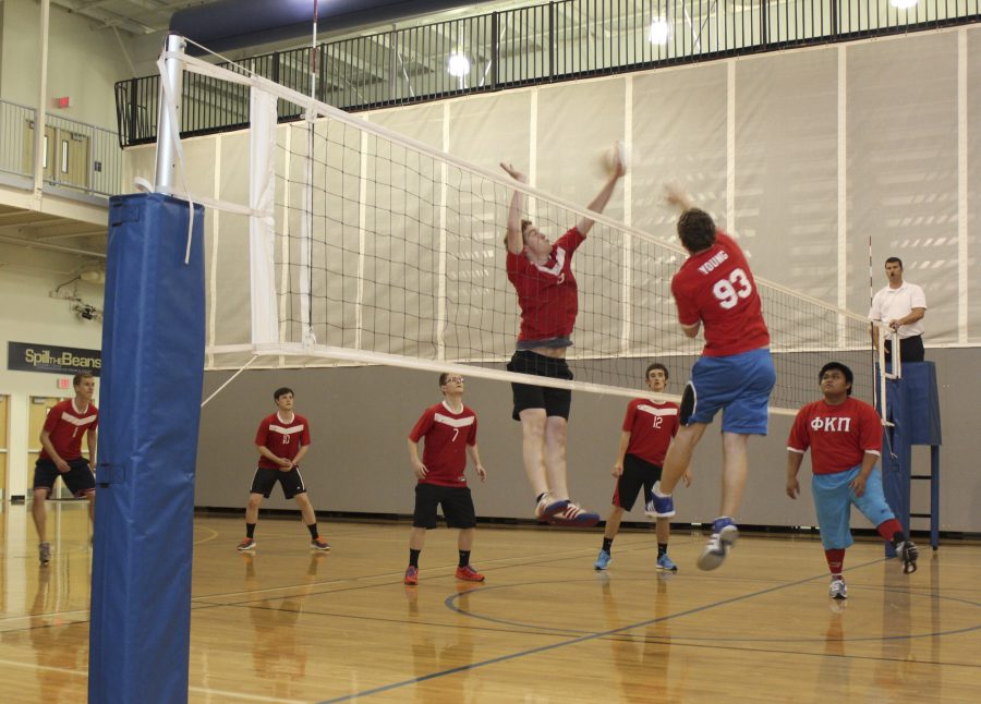 A+Spartans+player+jumps+to+block+a+spike+by+Rams+coach+Nathan+Young.++++Photo%3A+Olivia+Prairie