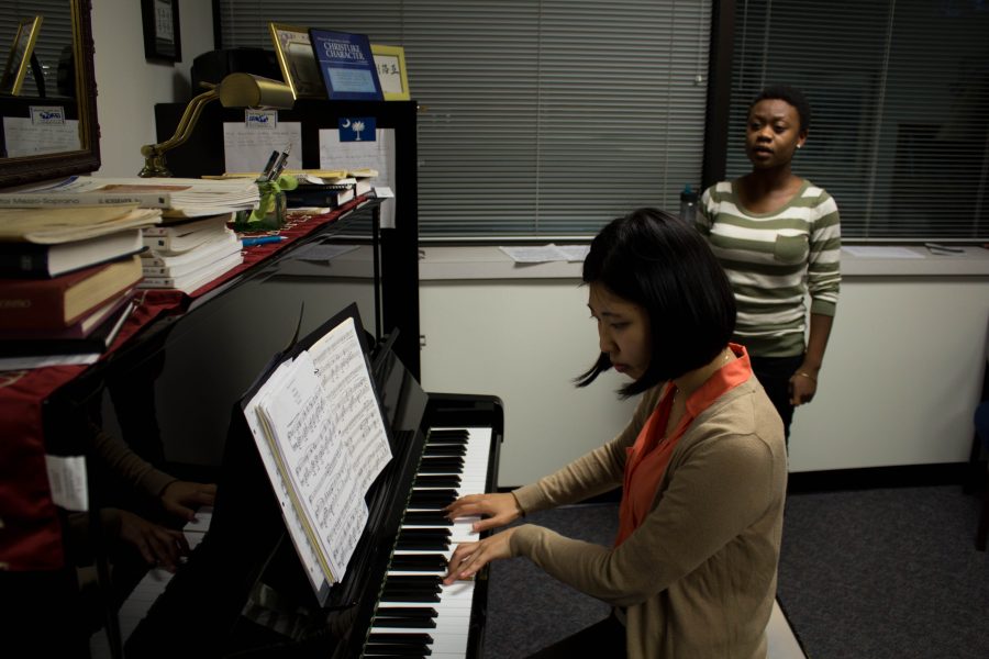 Senior voice performance major Lydia Jackson rehearses with her accompanist for Student Recital Hour. Photo: Ethan Rogers