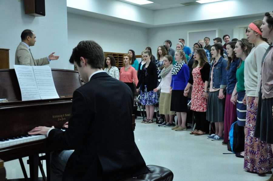 Sam Brown plays piano as the University Singers rehearse for their upcoming concert at Carnegie Hall. Photo: Ciara Weant