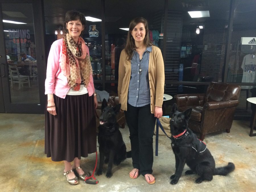 Joan Parker (left) and Rebecca Renner stand with service dogs ULA (left) and UMA.  Photo: Natalie Walters