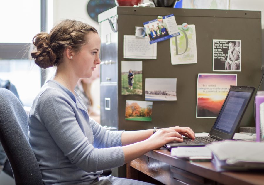 Grad assistant, Emily Meyers, works in her office. Photo by Holly Diller