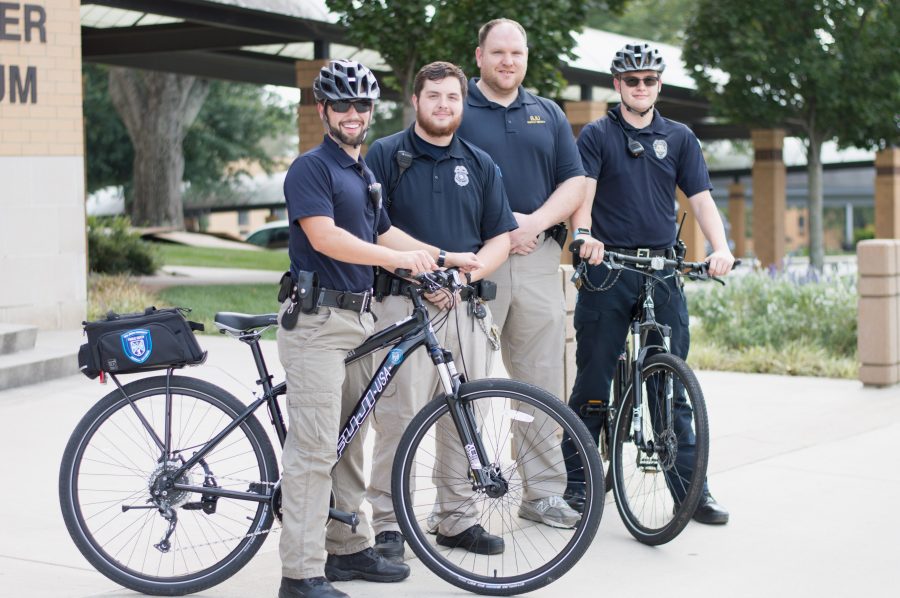 DPS officers David Beckwith, Harry Miller, James Rulapaugh and Ryan Kiehl use bike partol to engage campus in a new and personal way.    Photo: Rebecca Snyder