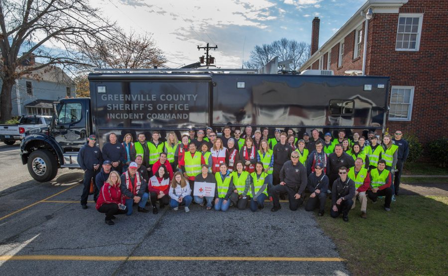 BJU students work with American Red Cross, Greenville Fire Department and Police to install smoke alarms in the community surrounding Poe Baptist Church, Greenville, SC, March 11, 2017. (Hal Cook)