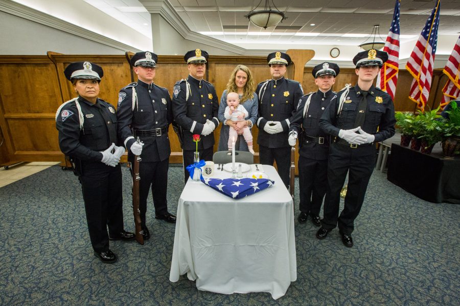 Meghan and Lennox Jacobs pose with law enforcement personnel at last year’s inaugural breakfast.    Photo: Derek Eckenroth