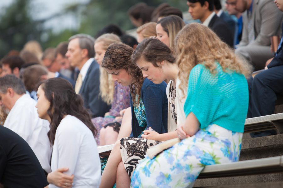 Bethany (left) and Sarah (right) Lawlor pray Easter morning at last years sunrise service.    Photo: BJU Marketing