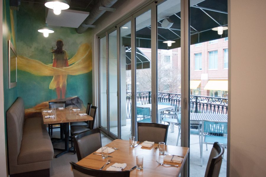 Murals and interesting wall art add to the restaurant’s sophisticated ambiance.    Photo: Rebecca Snyder