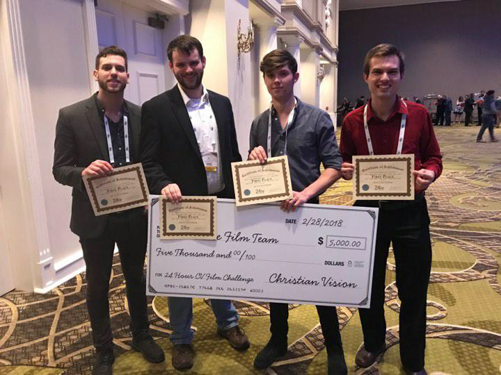 Caleb Murphy, J.D. Surrett, Nicholas Yasi and Stephen Dysert (left to right)  celebrate with their $5,000-prize.    Photo: Submitted