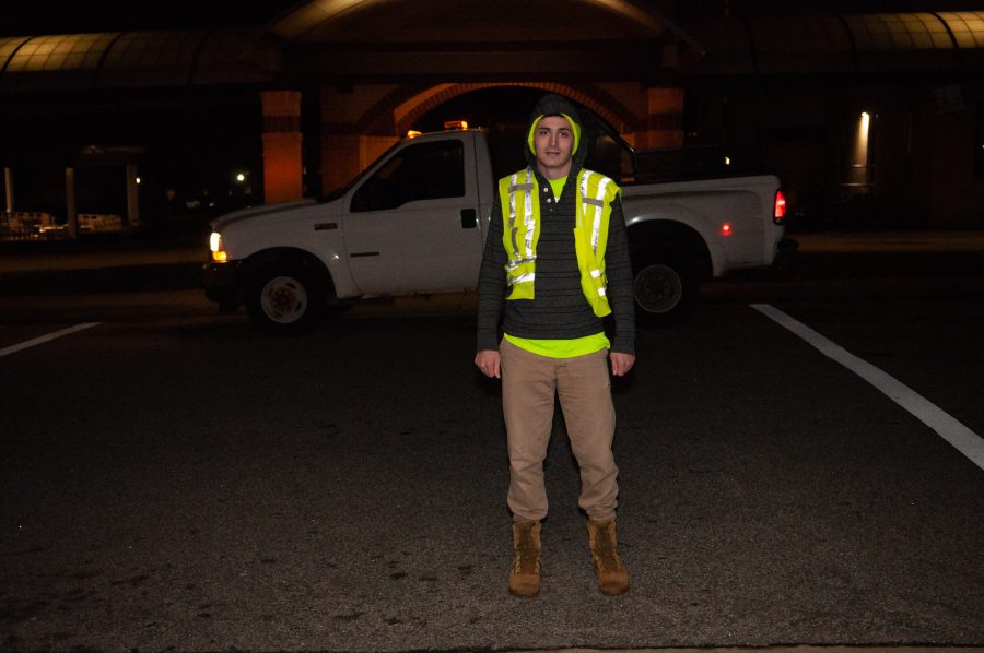 Students work to keep campus safe and clean during the night after curfew, BJU, Greenville Downtown Airport, Greenville, SC, April 16, 2018. (Rebecca Snyder)