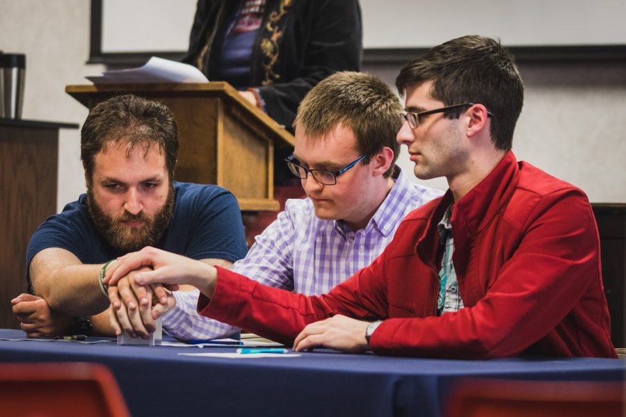 Kamron Hamedi, Nathan Collins and Jacob Rapier compete for Brian in the Scholastic Bowl.    Photo: Daniel Petersen