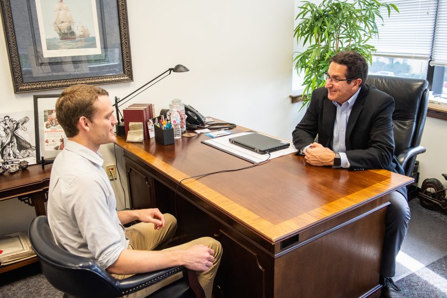 Dr. Neal Cushman meets with Stephen Lemp to discuss possible choices in the seminary program.  Photo: Robby Jorgensen
