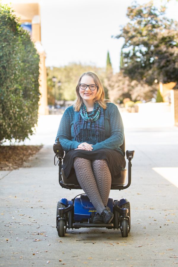 Karissa Oberman poses for a portrait as part of an article about students with physical disabilities.