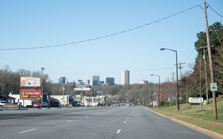 The+Greenville+skyline+peeks+out+above+the+trees+on+Wade+Hampton+Boulevard%2C+Greenville%2C+SC%2C+March+18%2C+2019.+%28Charles+Billiu%29