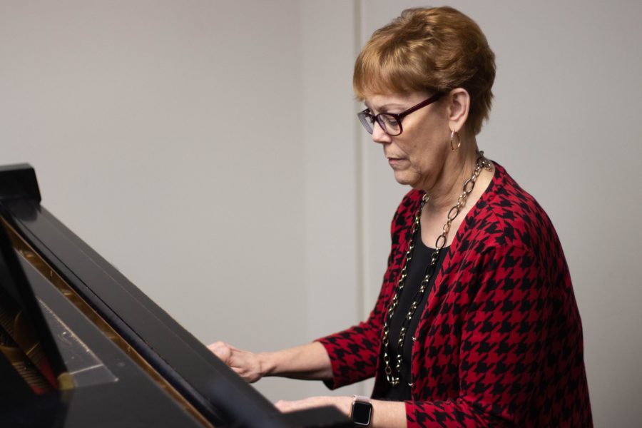 Mrs. Lopez sitting by the piano in her office. Greenville, SC, BJU, February 25th, 2020, Andrew Pledger