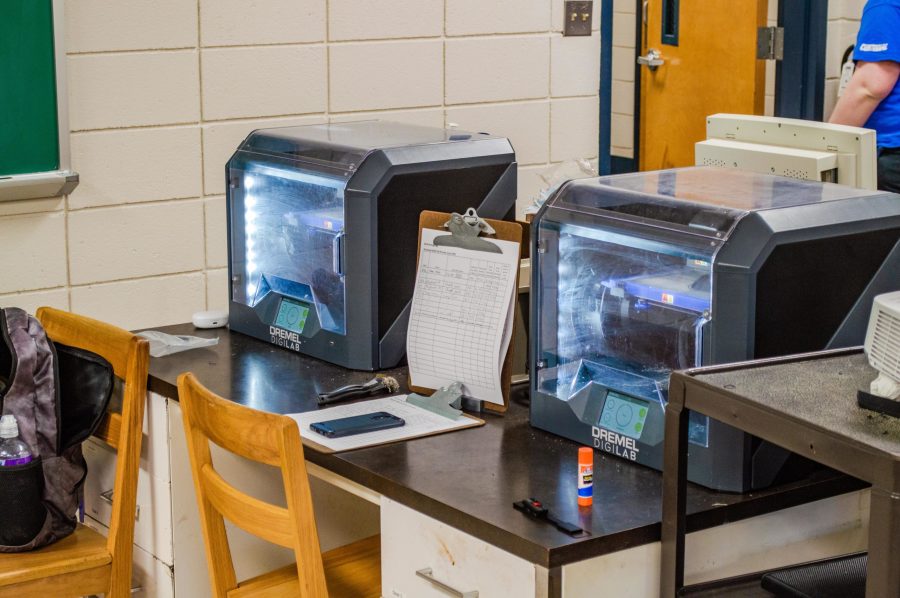 The students use multiple 3D printers to produce their designs. Photo: Heath Parish