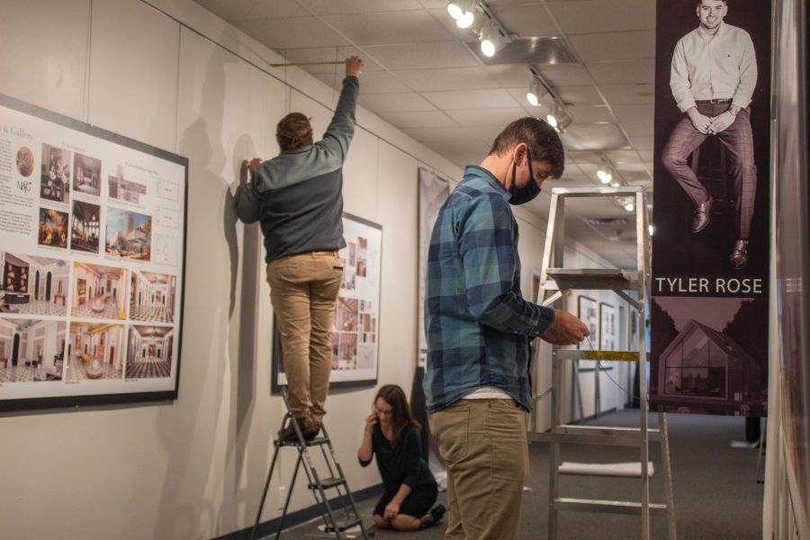 Art students and faculty set up for the interior architecture and design show. Photo: Robert Stuber