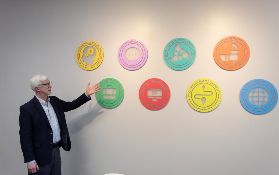 Career Services director Shawn Albert gestures toward symbols of
the National Association of Colleges and Employers.