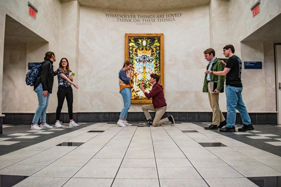 Rightfully destitute freshmen witness another successful proposal. The couple took a more moderate approach to BJU dating, confirming their engagement after a leisurely week of dating. Photo: Madeline Peters