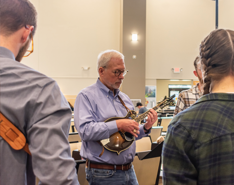 Pettit, a distinguished member of the Palmetto Mandolin Society, instructs students on a basic 12 finger plucking technique.Photos: Melia Covington
