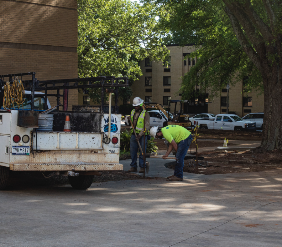 Workers replaced the old gravel path leading from the back of FMA to the Gustafson Fine Arts Center
with a concrete sidewalk in time for commencement.
Photo: Alicia Cannon