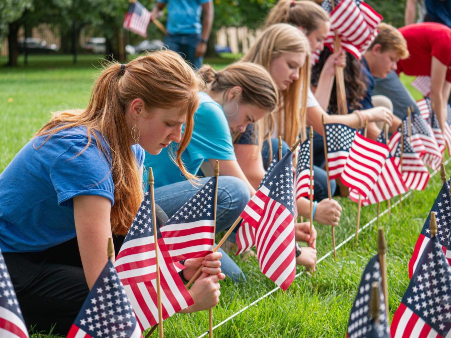 BJU Students set up flags