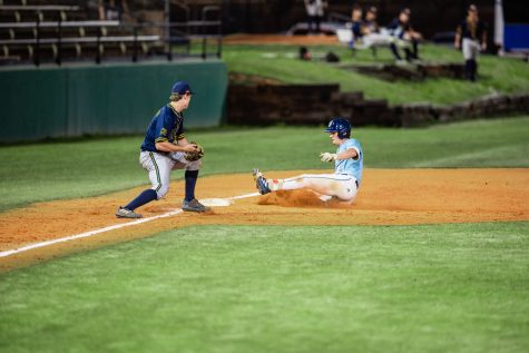 Bruins outfielder Riley Ramsey slides into base during the game against Truett McConnell University. Photo: Marissa Ellerbrock