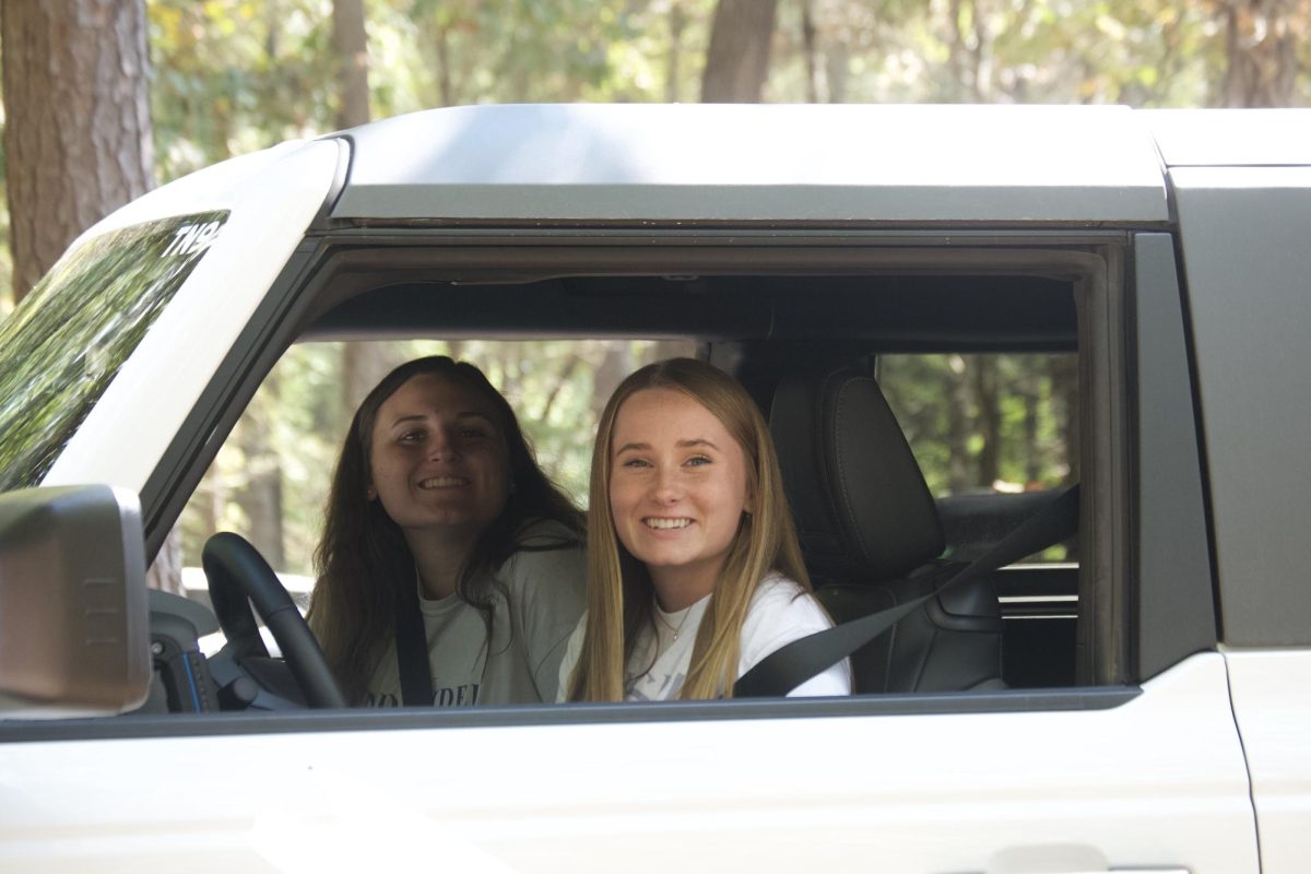 Jordan Meyer (right), a senior business administration major, and Eliza Thomas (left), a sophomore business administration major, enjoying their bronco.