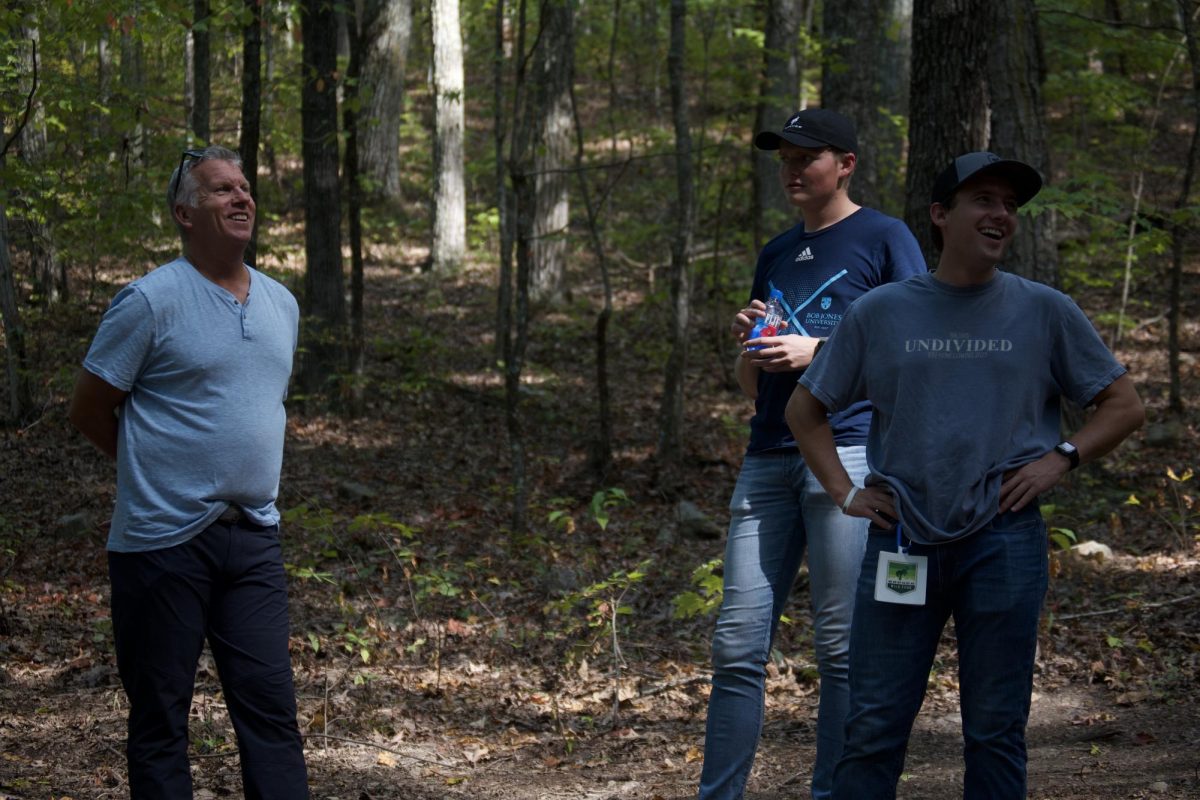 Josiah Sherrill (right), a senior Biblical studies major, Andrew Dubberly (middle), a senior business administration major, and Mark Kratts (left) watching their team come down the 30-degree slope.