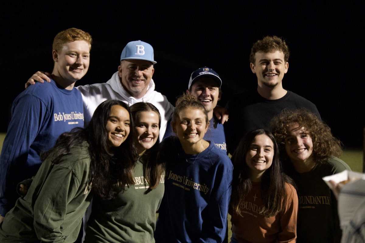 Students enjoy the faculty flag football game.