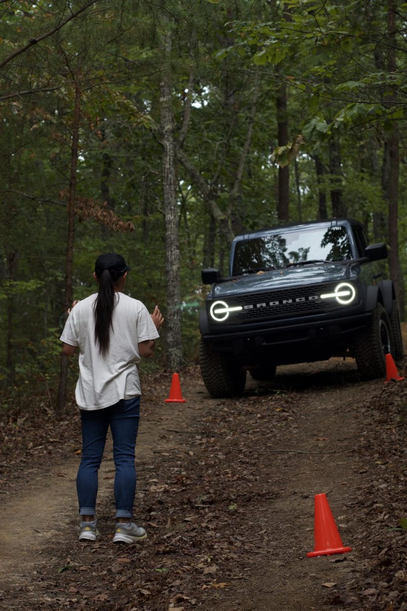 Tessa Bonnema, a sophomore computer science major, instructing a blind driver through the cones.