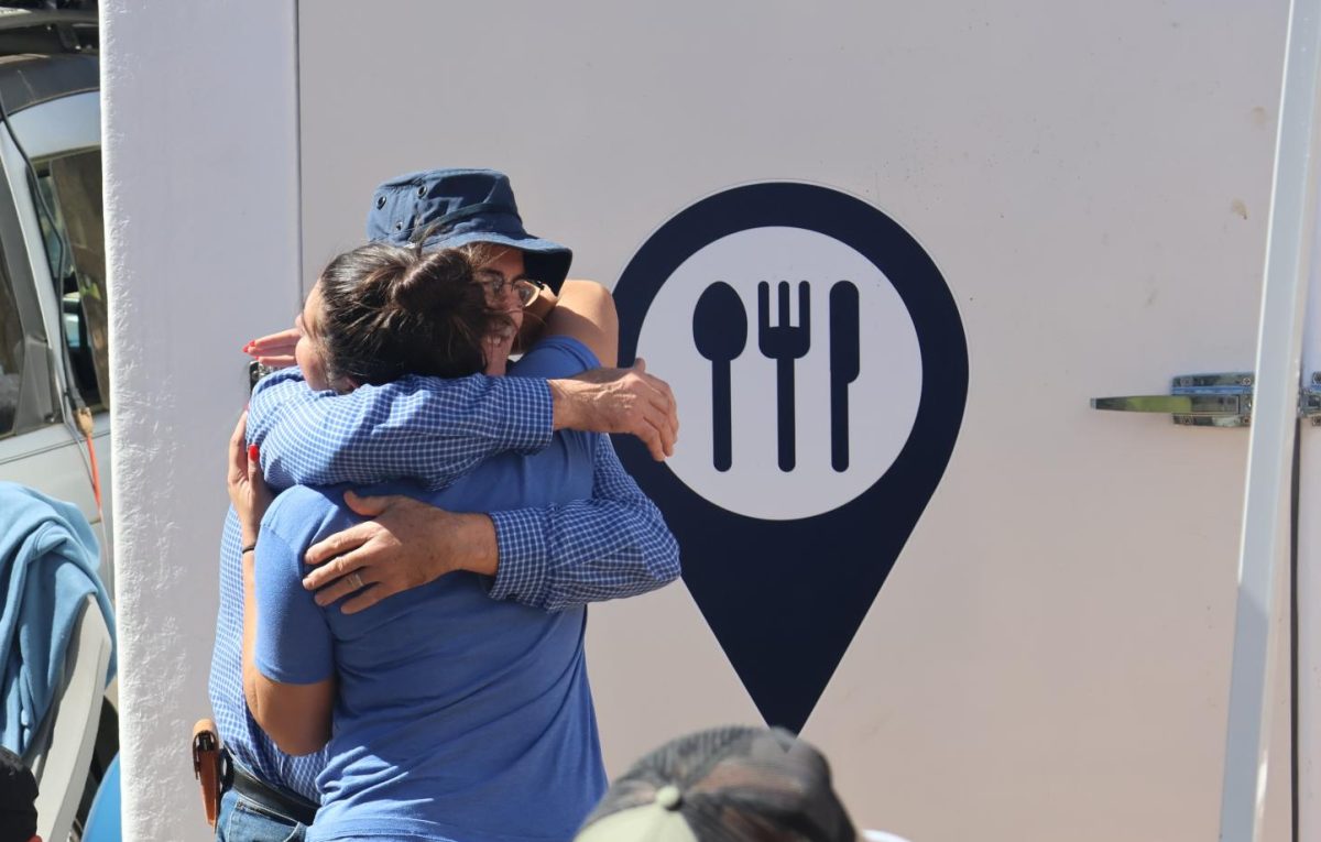 One man expresses his gratitude to volunteers providing meals in the Asheville area following Hurricane Helene's devastation.