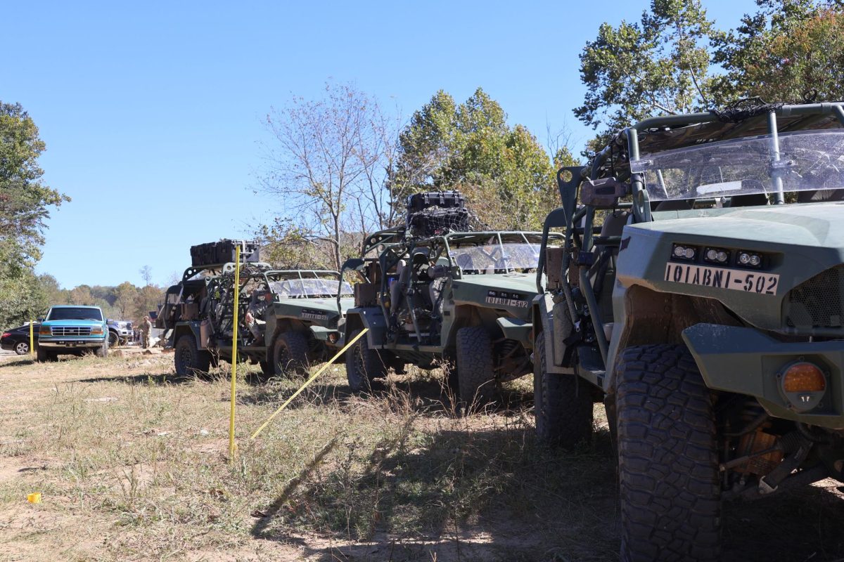 Army vehicles conducting cadaver searches and debris cleanup near Asheville.