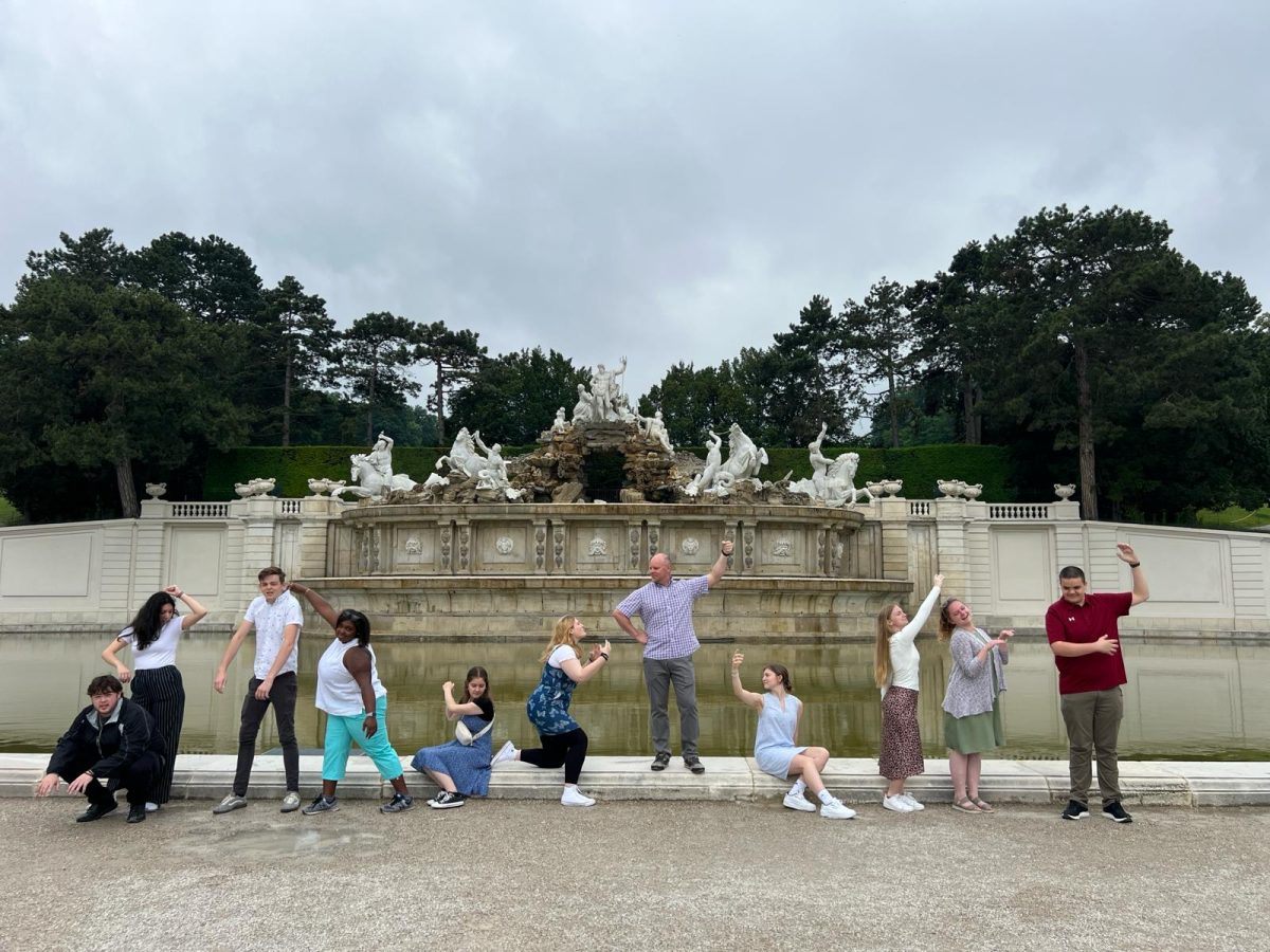 The Culinary Study Abroad team poses in front of statues. Photo submitted.