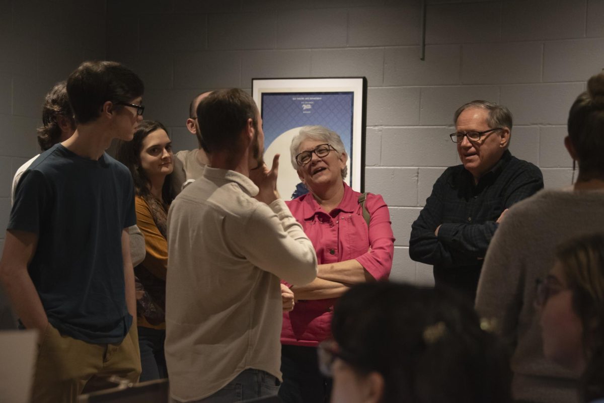 Audience members walk in to see Wait Until Dark directed by Taylor Stephens.