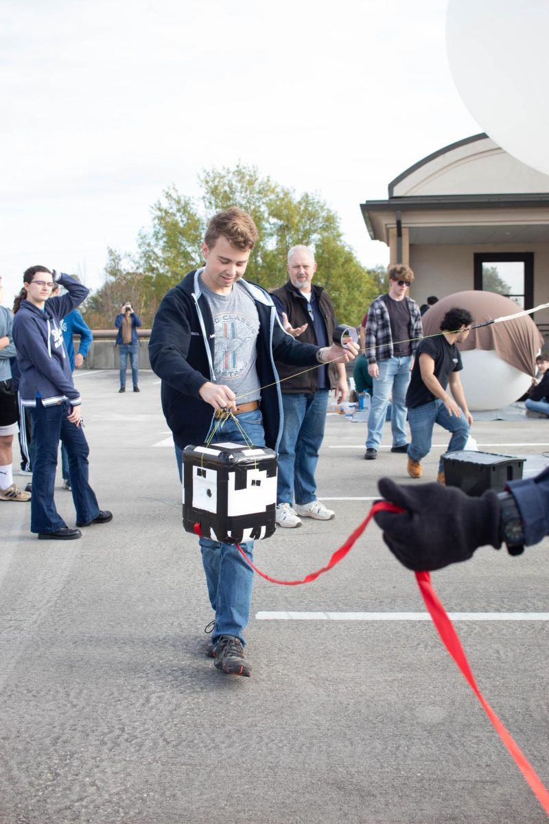 A student carries the payload.