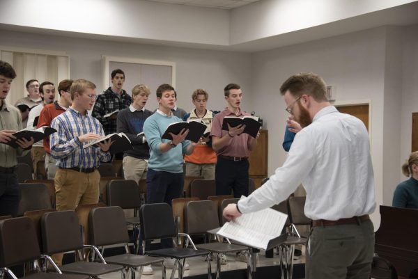 Choirs preparing for Handel's Messiah in sectionals in the Fine Arts Building, 2024.