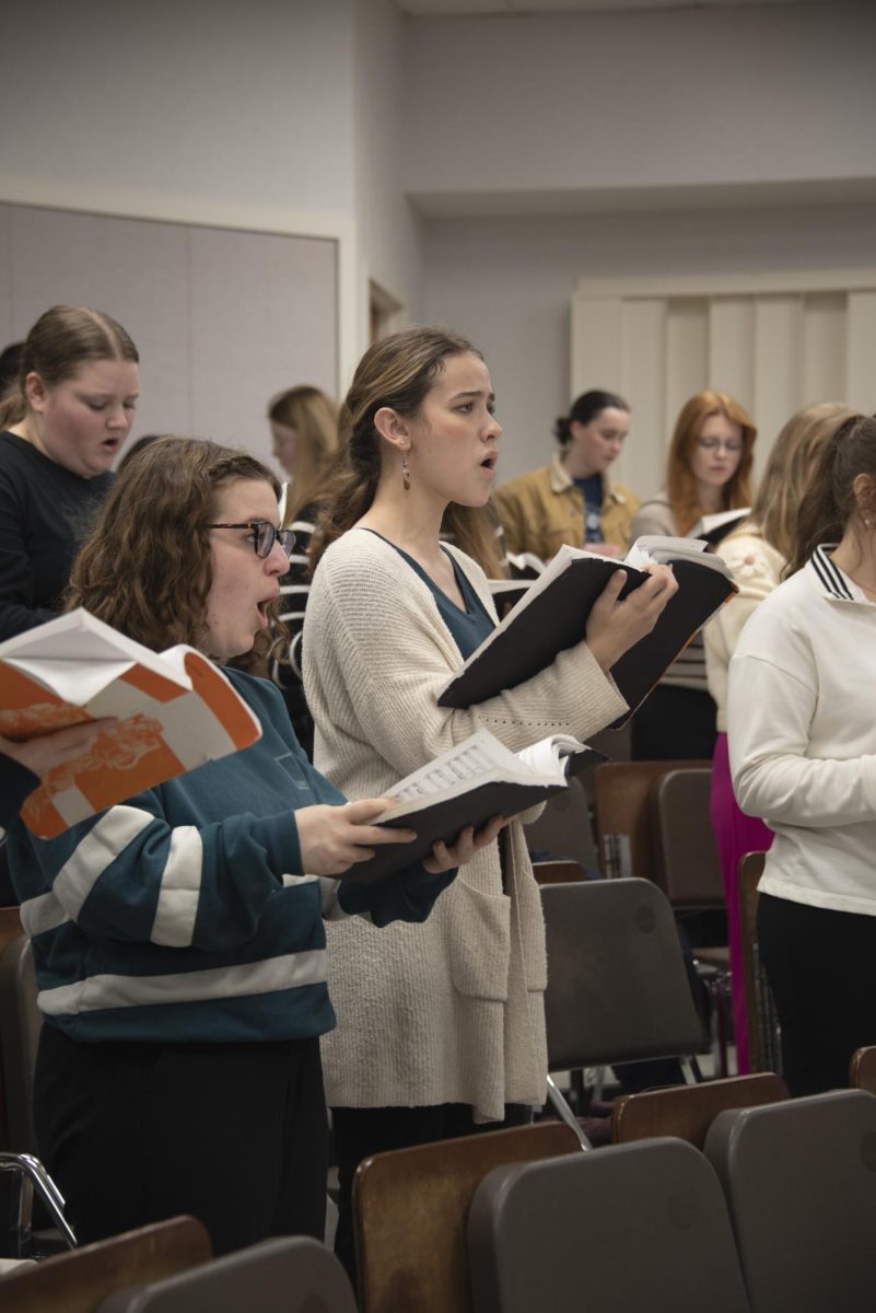 Choirs preparing for Handel's Messiah in sectionals in the Fine Arts Building, 2024.