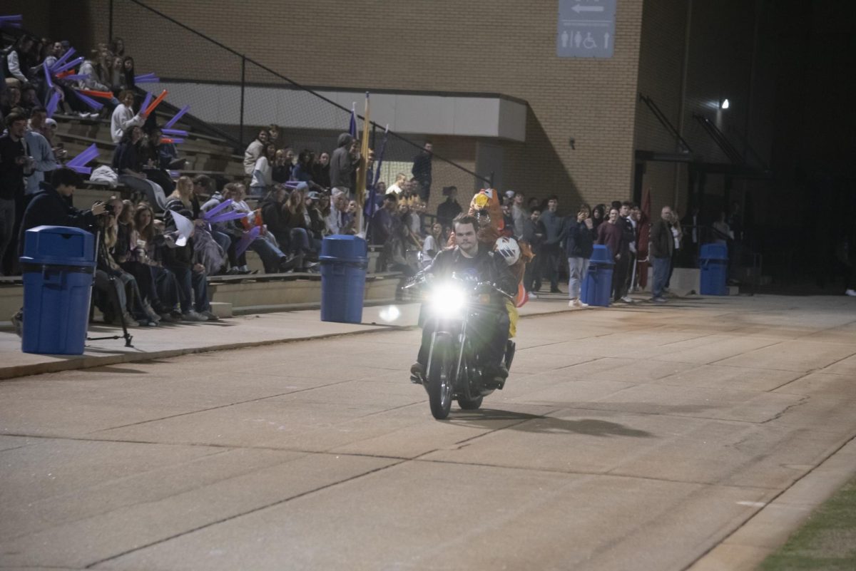 Nathaniel Brunson bringing the soccer ball to the field.