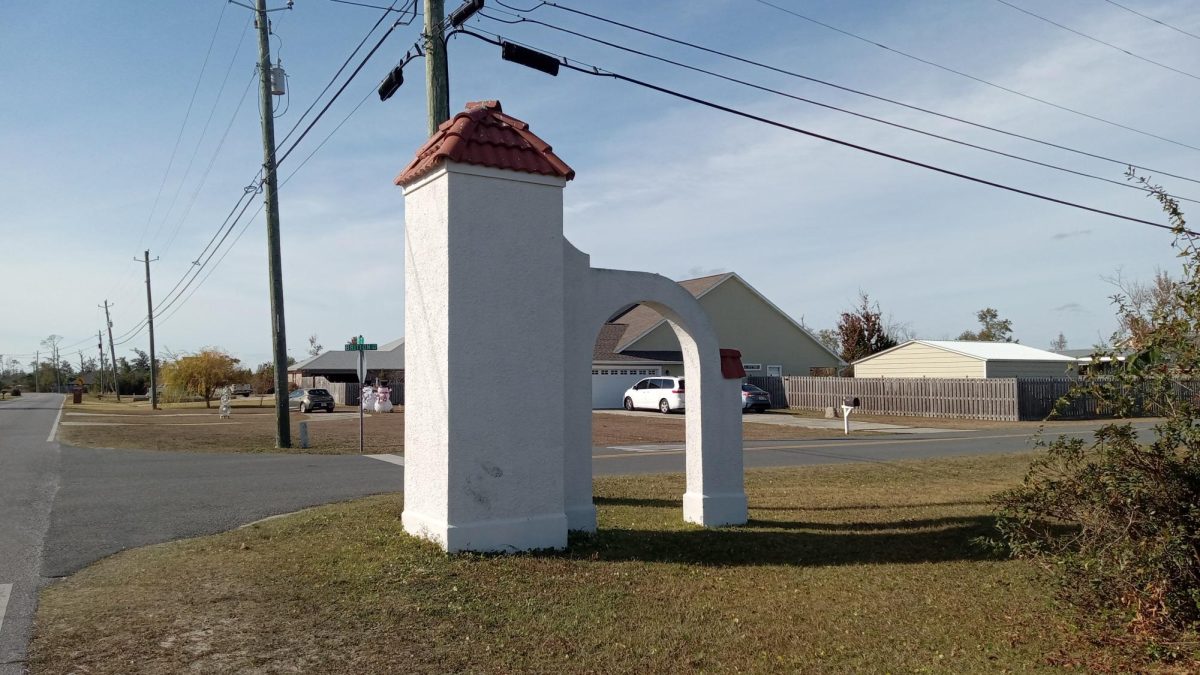 One of the two arches at the entrance of College Point. 